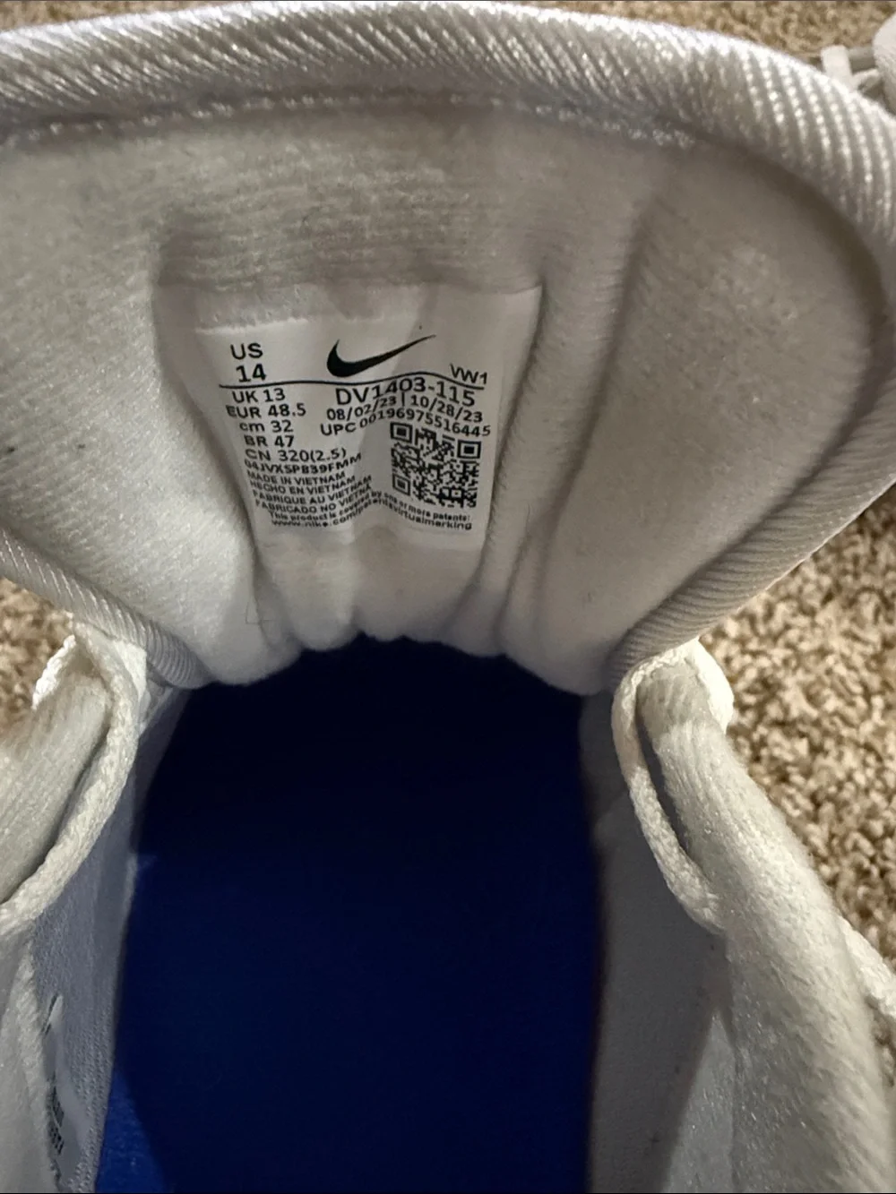 White and Blue Nike golf shoes